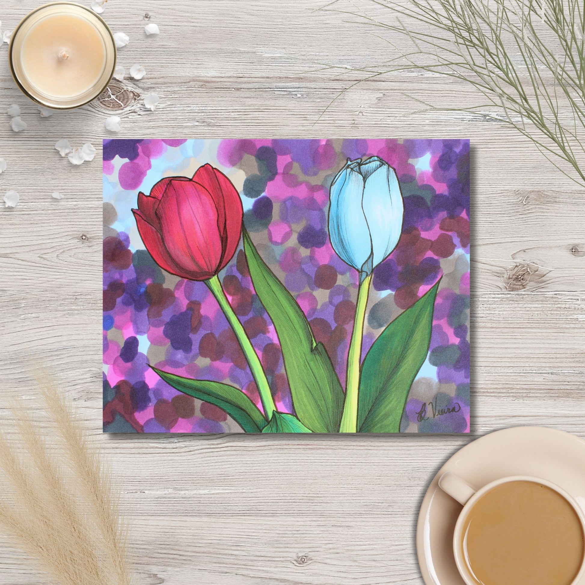 Colorful tulip marker drawing on a wooden surface with a cup of coffee and candle.