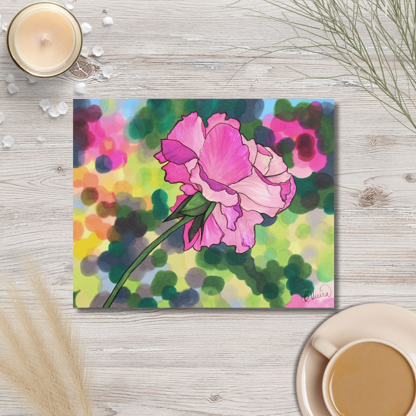 Colorful marker drawing of a pink flower on a wooden surface with a cup of coffee and a candle.
