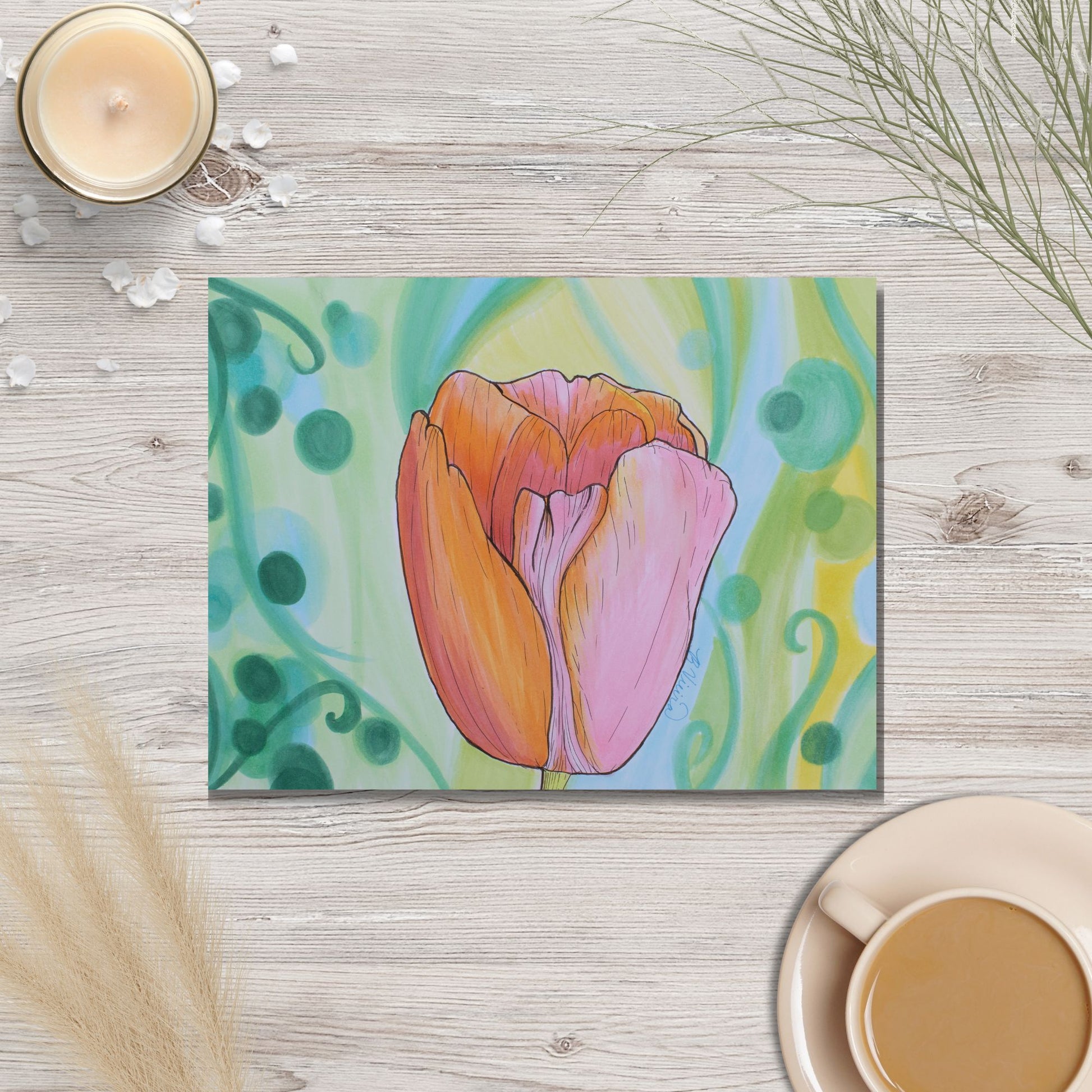 Colorful tulip marker drawing on a wooden surface with a cup of coffee and candle.