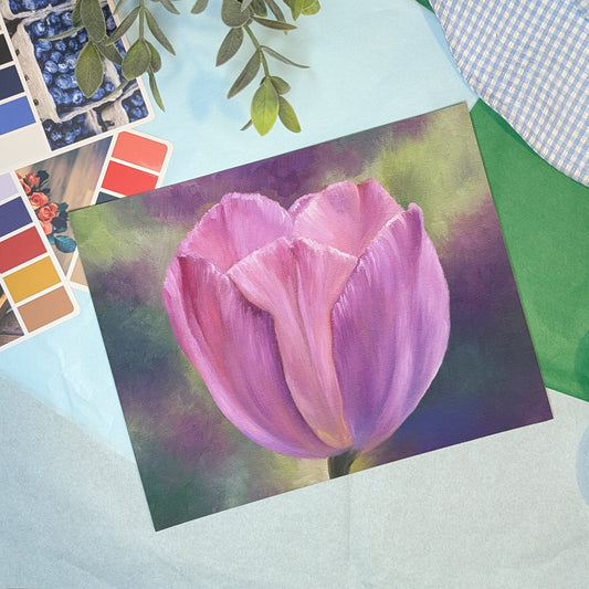 Painting of a pink tulip on a textured surface with color swatches and plants.
