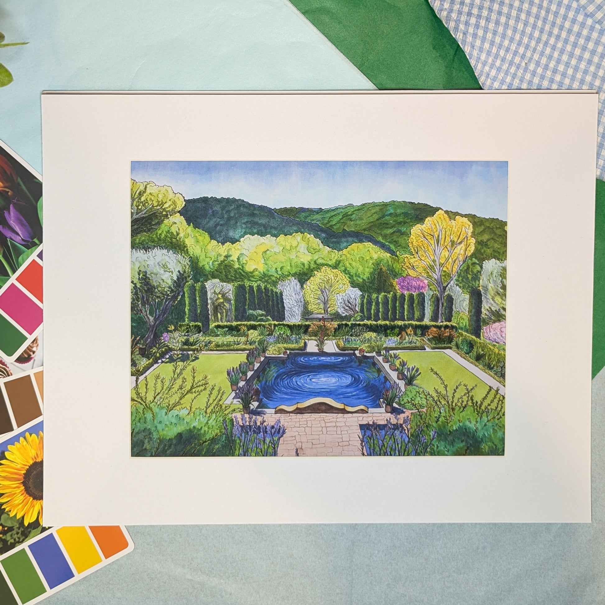 Colorful illustration of a garden scene with a pool, framed against a colorful background.